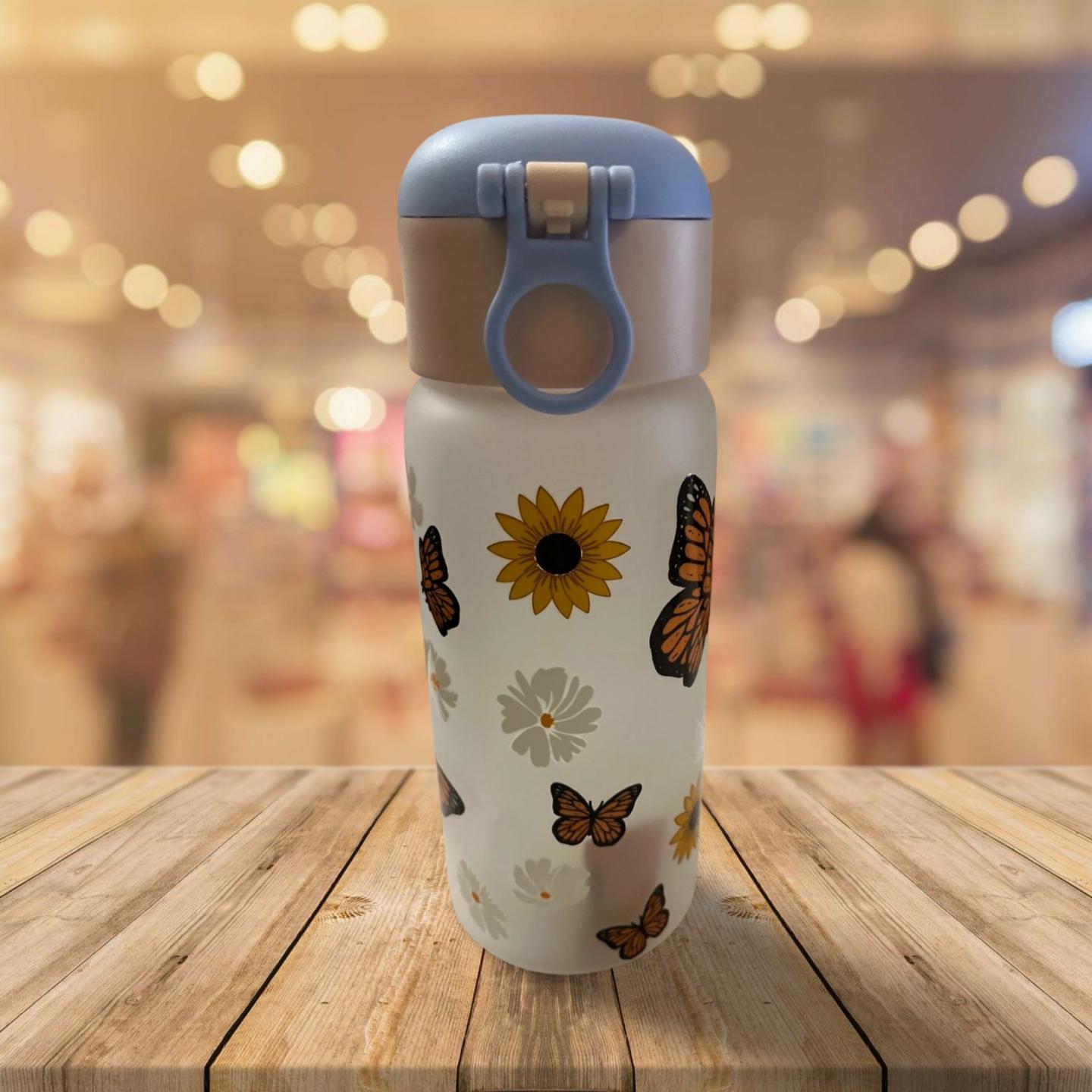 15 oz Frosted Glass Water Bottle with Blue Lid- Flowers and butterflies