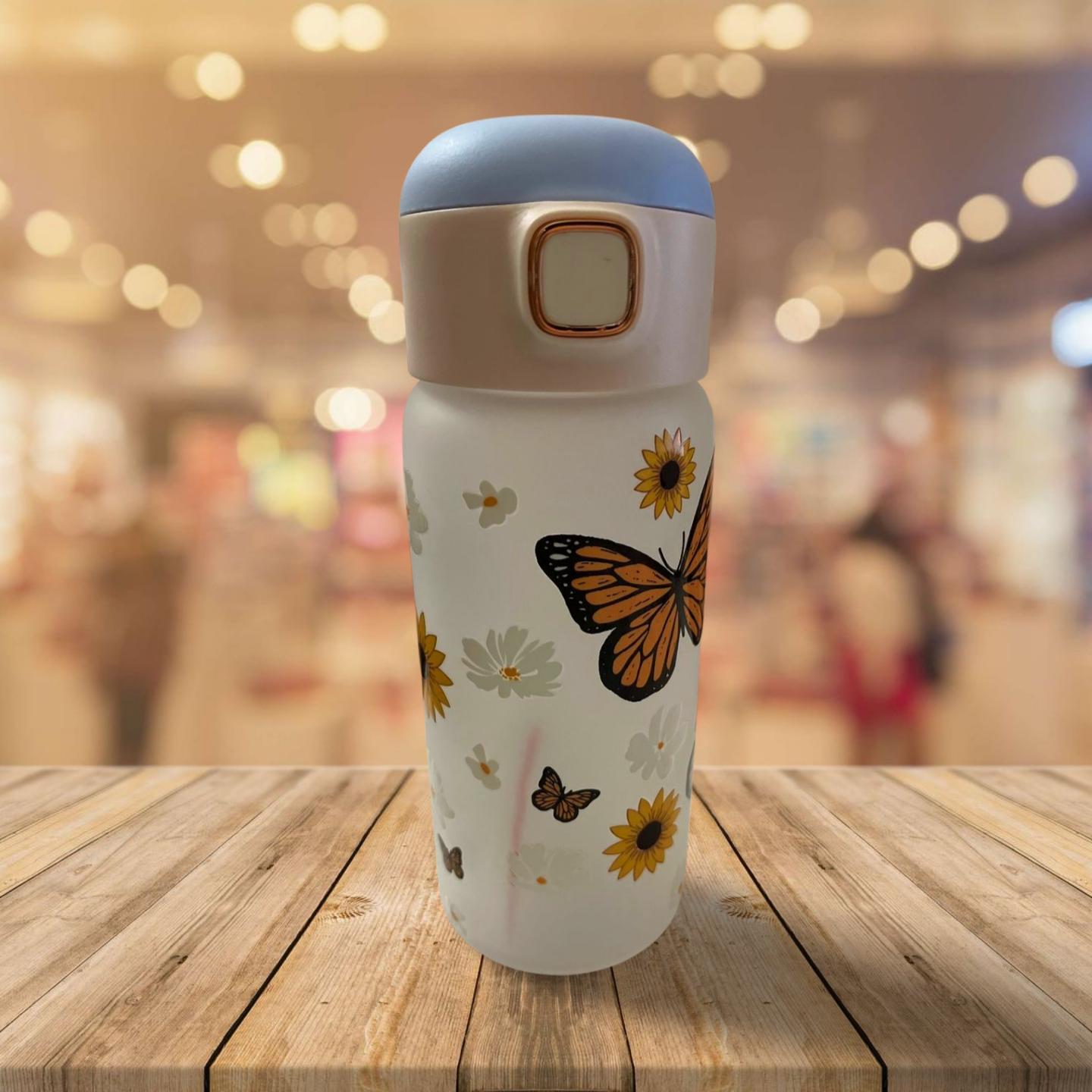 15 oz Frosted Glass Water Bottle with Blue Lid- Flowers and butterflies